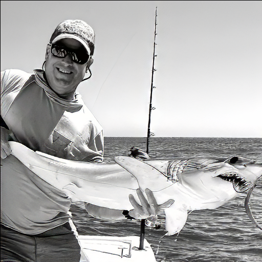 Capt. Greg Stutzer and a small mako shark on fly